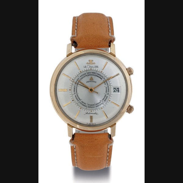 LECOULTRE. A 10K GOLD-FILLED WORLD TIME WRISTWATCH WITH DATE, CENTER SECONDS AND ALARM SIGNED LECOULTRE, MEMODATE, CIRCA 1955