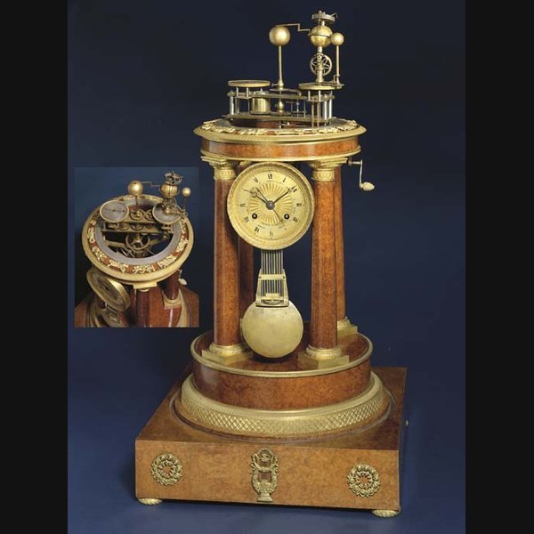 A Charles X amboyna and ormolu-mounted striking and musical orrery clock RAINGO, PARIS. CIRCA 1825/1830