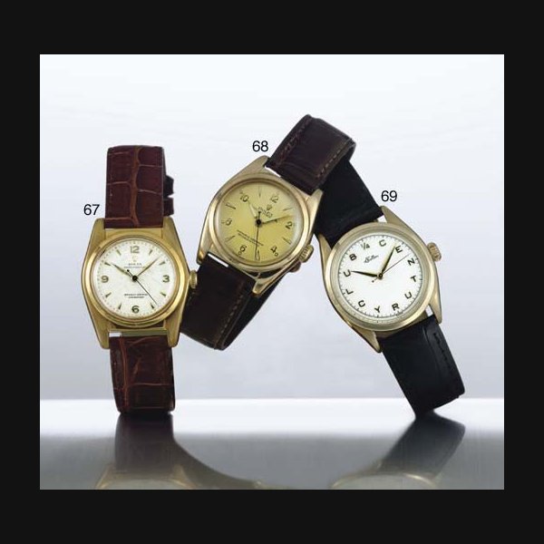 ROLEX. A STAINLESS STEEL AND GOLD AUTOMATIC WRISTWATCH WITH CENTER SECONDS SIGNED ROLEX, OYSTER PERPETUAL, MOVEMENT NO. 71502, REF. 2940, CIRCA 1945