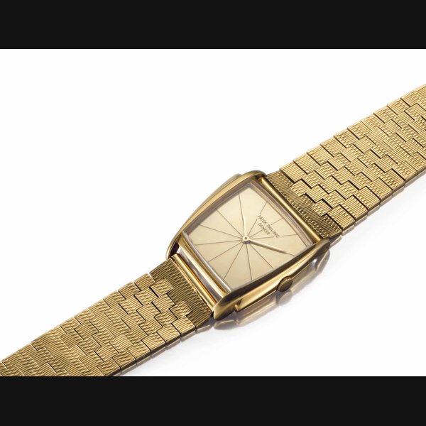 Patek Philippe. An Extremely Fine and Rare 18k Gold Asymmetrical Wristwatch with Champagne Dial and Bracelet, Designed by Gilbert Albert and Retailed by Serpico Y Laino SIGNED PATEK PHILIPPE, GENÈVE, RETAILED BY SERPICO Y LAINO, REF. 3422, MOVEMENT NO. 861'488, CASE NO. 2'626'924, MANUFACTURED IN 1962