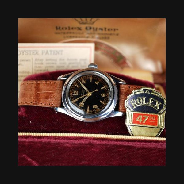 Rolex1942 Rolex 3136 Oyster Black Gilt Dial Full Set Box and Papers Museum-quality example