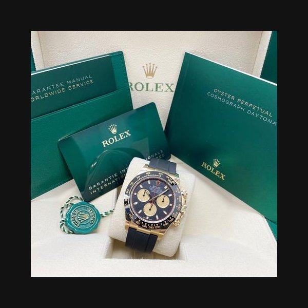 Rolex Rolex DaytonaUNWORN Daytona 116518 Yellow Gold 40mm Black Paul Newman Index Dial Black Oysterflex Unworn Complete Box & Papers