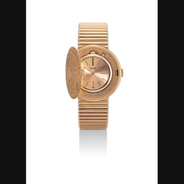 PIAGET. A HEAVY 18K PINK GOLD COIN BRACELET WATCH SIGNED PIAGET, CIRCA 1980
