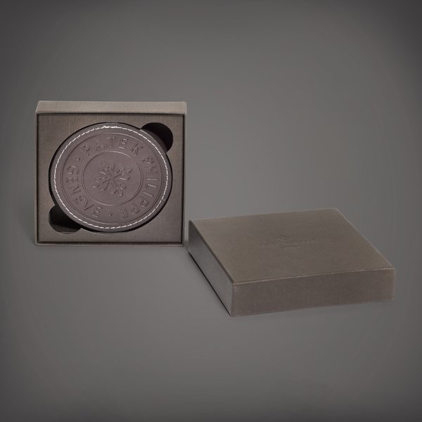 Patek Philippe A set of five embossed calf leather coasters | Circa 2018