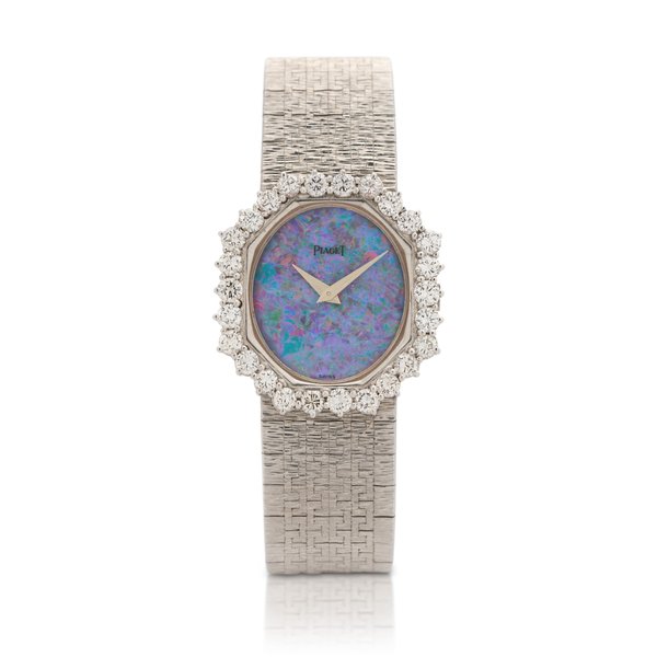 Piaget Ref. 93416 A6  White gold and diamond-set bracelet watch with opal dial  Circa 1975 · 93416