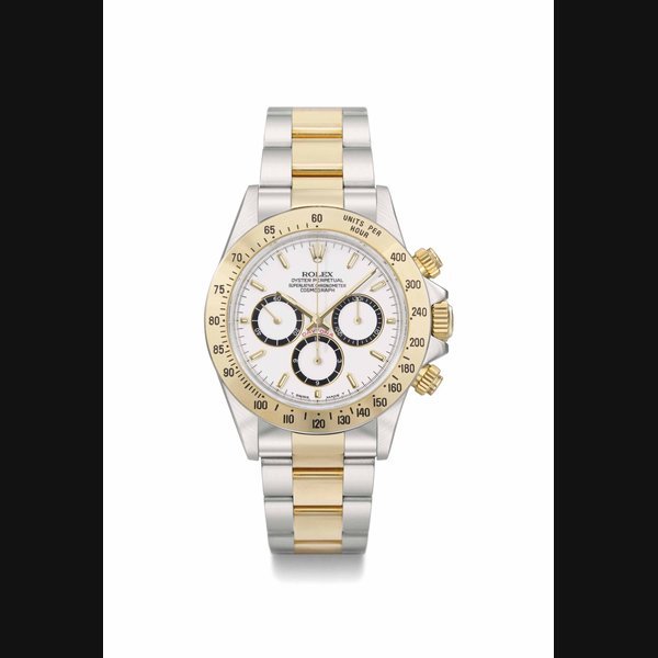 Rolex Rolex. An extremely rare and attractive stainless steel and 18K gold automatic chronograph wristwatch with "four-liner porcelain" dial, bracelet, original guarantee and box SIGNED ROLEX, OYSTER PERPETUAL, SUPERLATIVE CHRONOMETER, COSMOGRAPH, DAYTONA, REF. 16523, CASE NO. L718620, MANUFACTURED IN 1989