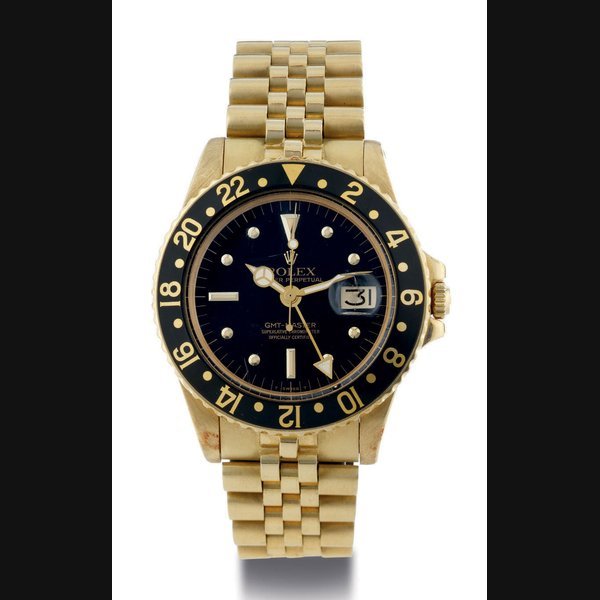 Rolex ROLEX. AN 18K PINK GOLD AUTOMATIC WRISTWATCH WITHD DATE, 24 HOURS, CENTER SECONDS AND BRACELET SIGNED ROLEX, OYSTER PERPETUAL, GMT-MASTER, CASE NO. 2869869, REF. 1675, CIRCA 1970 · 1675