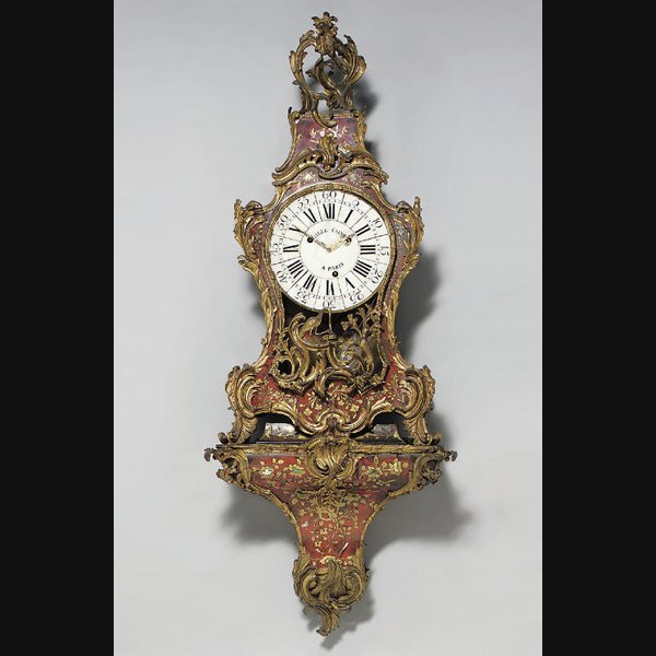A Louis Xv Large Ormolu-Mounted A Louis XV large ormolu-mounted, foliate cut brass and stained ivory inlaid red tortoiseshell quarter-striking bracket clock, on wall bracket GILLE L'AINÉ, PARIS. SECOND QUARTER 18TH CENTURY