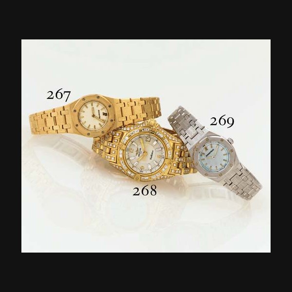 BREITLING. A FINE LIMITED EDITION LADY'S 18K GOLD AND DIAMOND WRISTWATCH WITH CENTER SECONDS, DATE AND BRACELET SIGNED BREITLING, "CALLISTINO BAGUETTES", NO. 1/5, REF. K52045, CIRCA 1998
