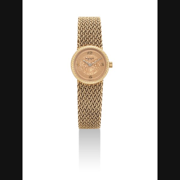 PATEK PHILIPPE. A LADY'S FINE 18K GOLD BRACELET WATCH SIGNED PATEK PHILIPPE, GENEVE, REF. 4512/1, MOVEMENT NO. 1'410'989, CASE NO. 2'816'946, MANUFACTURED IN 1984