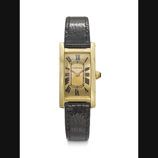 CARTIER. AN EXTREMELY RARE AND ELEGANT RECTANGULAR CURVED 18K GOLD WRISTWATCH TANK CINTRÉE MODEL, CASE NO. 033'354, CIRCA 1970