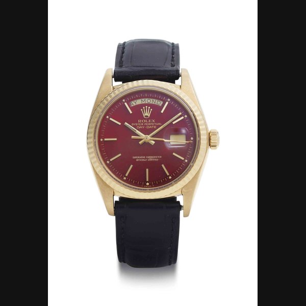 Rolex. A Fine And Rare 18k Gold Automatic Wristwatch With Day, Date And Ox Blood Dial SIGNED ROLEX, OYSTER PERPETUAL, DAY-DATE, REF. 1803, CASE NO. 3'668'446, CIRCA 1972