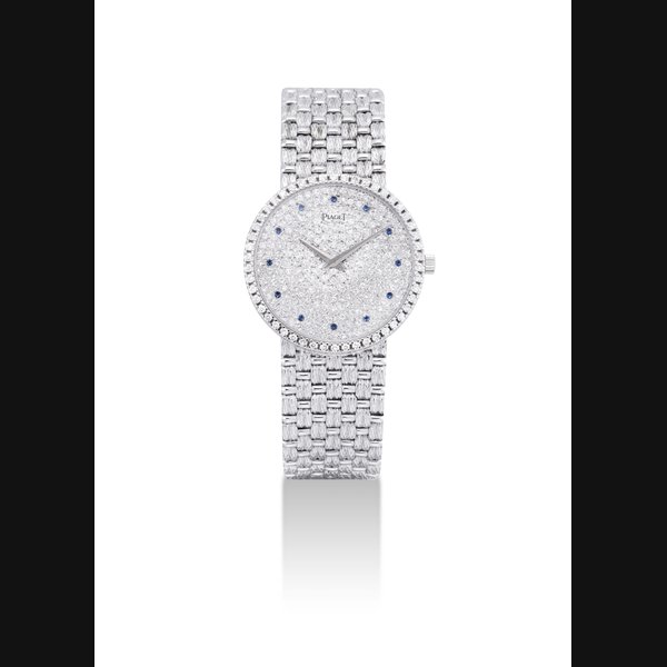 PIAGET. AN 18K WHITE GOLD, DIAMOND AND SAPPHIRE-SET BRACELET WATCH SIGNED PIAGET, REF. 9066 D23, CASE NO. 501'106, CIRCA 1995