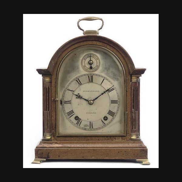 A German small mahogany quarter-chiming eight day table clock WINTERHALDER & HOFMEIER, RETAILED BY W. HAMILTON & SON. EARLY 20TH CENTURY
