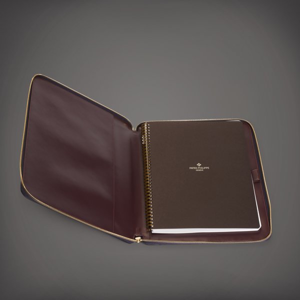 Patek Philippe A blue Saffiano leather zipped padfolio and notebook | Circa 2018