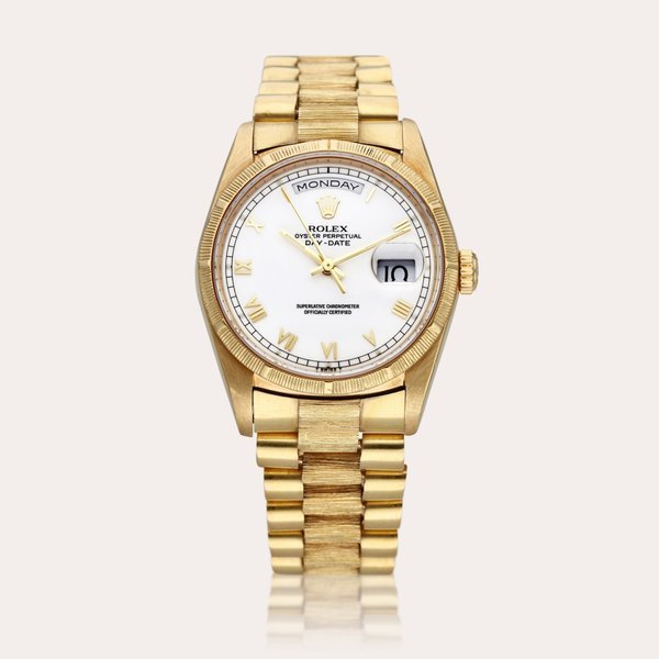 Rolex Reference 18248 Day-Date ‘Bark’ | A yellow gold automatic wristwatch with day, date, and bark finish bezel and bracelet, Circa 1988 · 18248