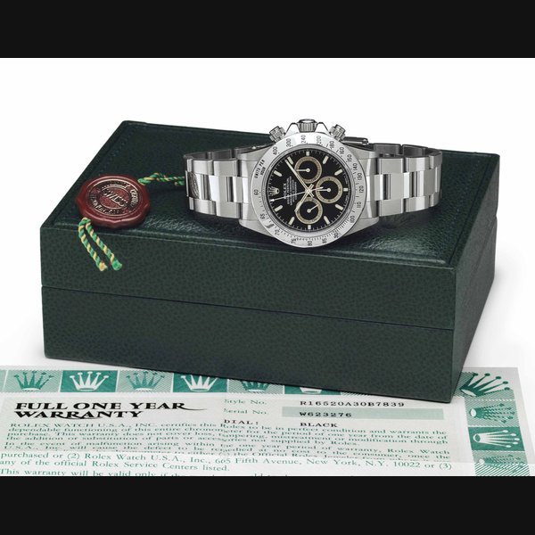 Rolex Rolex. A Stainless Steel Automatic Chronograph Wristwatch with Black Dial, Brown Color-Change Subsidiary Dials, Bracelet, Box and Original Guarantee SIGNED ROLEX, OYSTER PERPETUAL, SUPERLATIVE CHRONOMETER, OFFICIALLY CERTIFIED, COSMOGRAPH DAYTONA, REF. 16520, CASE NO. W623276, MANUFACTURED IN 1993