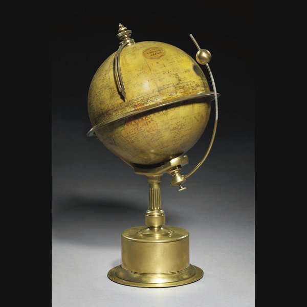 A George V brass eight day revolving globe timepiece: 'The Empire Clock' CIRCA 1910