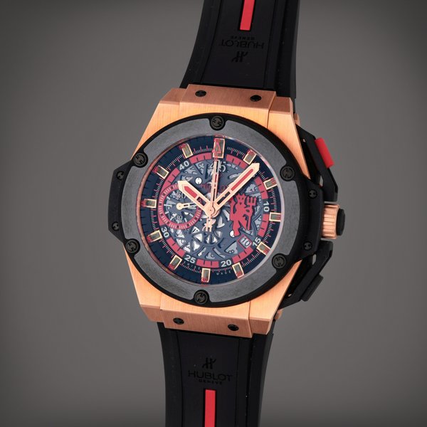Hublot King Power Manchester United 'Red Devil' , Reference 716.CI.1129.RX.MAN11 | A titanium and pink gold chronograph wristwatch with date | Circa 2012