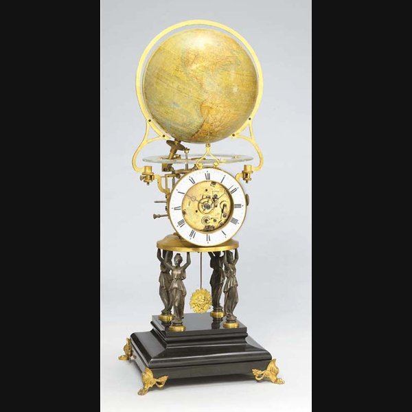 A French Gilt-Brass A French gilt-brass, silvered metal and black marble revolving globe timepiece VICTOR LANEUVILLE, PARIS, THE GLOBE BY MAISON DELAMARCHE. CIRCA 1885