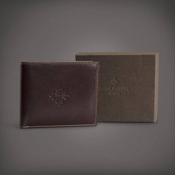 Patek Philippe A brown calf leather bifold wallet | Circa 2018
