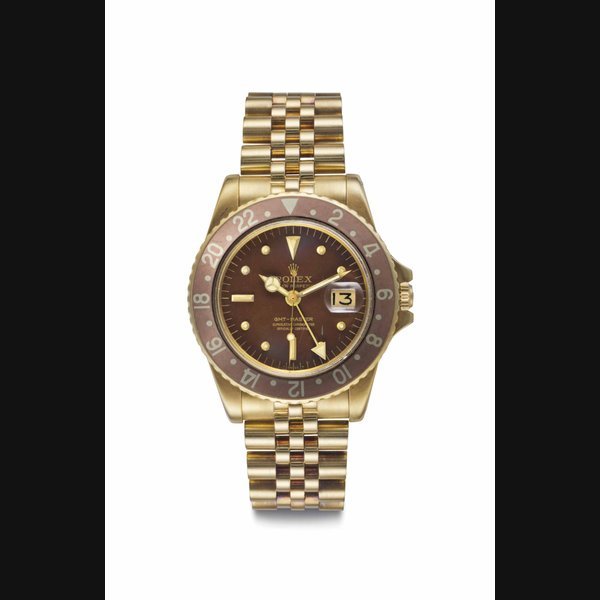 Rolex Rolex. A Fine and Attractive 18k Gold Automatic Dual Time Wristwatch with Date, Center Seconds and Bracelet Signed Rolex, Oyster Perpetual, GMT-Master, Ref. 1675, Case No. 1’919’585, Circa 1968 · 1675