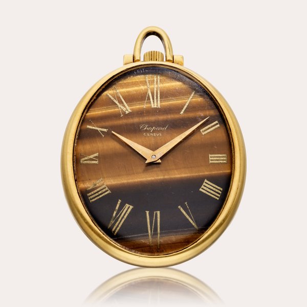 Chopard Reference 503016-0001 | A yellow gold open faced watch with Tiger’s eye dial, Circa 1975