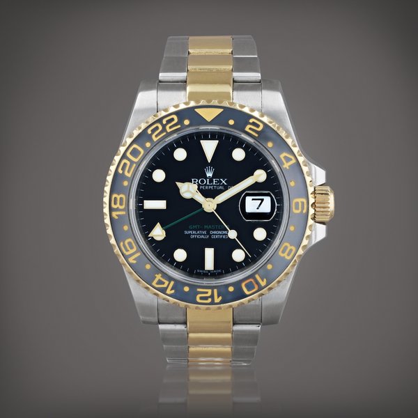 Rolex GMT-Master II, reference 116713     Montre bracelet à double fuseau horaire en acier et or jaune avec date |  Stainless steel and yellow gold dual time zone wristwatch with date and bracelet     Vers 2008 |  Circa 2008