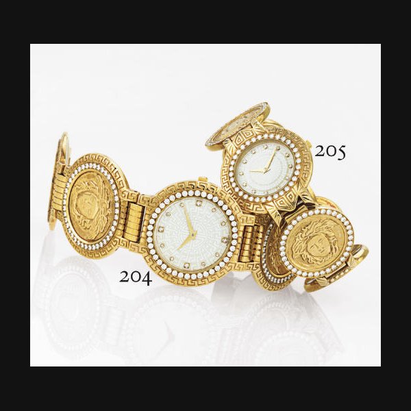 GIANNI VERSACE. A LADY'S HEAVY 18K GOLD AND DIAMOND MEDALLION BRACELET WATCH SIGNED GIANNI VERSACE, SIGNATURE, NO. 00038, CIRCA 1990