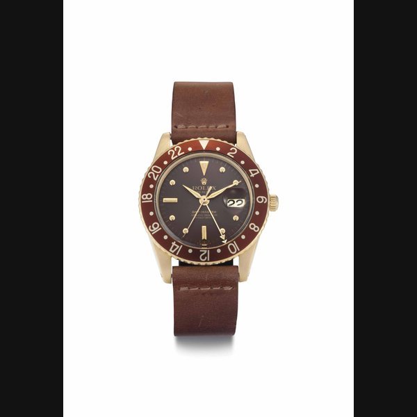 Rolex Rolex. A Fine and Rare 18k Gold Automatic Dual Time Wristwatch with Center Seconds, Date, Transitional Case without Crown Guards, Original Guarantee and Box SIGNED ROLEX, OYSTER PERPETUAL, GMT-MASTER, SUPERLATIVE CHRONOMETER OFFICIALLY CERTIFIED, REF. 1675, CASE NO. 1'117'341, CIRCA 1964 · 1675