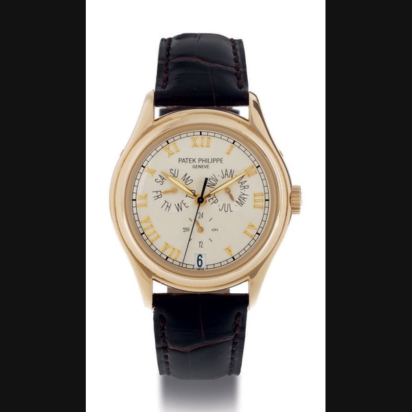 PATEK PHILIPPE. AN 18K GOLD AUTOMATIC ANNUAL CALENDAR WRISTWATCH WITH CENTER SECONDS SIGNED PATEK PHILIPPE, GENEVE, MOVEMENT NO. 3055336, CASE NO. 2999865, REF. 5035, MANUFACTURED IN 1996