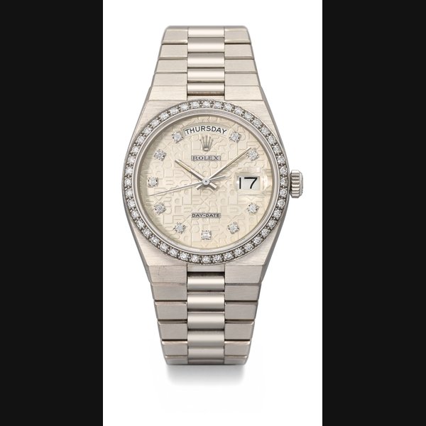 ROLEX. A FINE AND VERY RARE 18K WHITE GOLD AND DIAMOND-SET WRISTWATCH WITH SWEEP CENTRE SECONDS, DATE, DAY, DIAMOND-SET DIAL AND BRACELET SIGNED ROLEX, OYSTER, DAY-DATE, REF. 19058, CASE NO. 8’036’297, CIRCA 1983