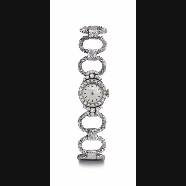 Patek Philippe. A Lady's 18k White Gold and Diamond-set Bracelet Watch SIGNED PATEK PHILIPPE, GENÈVE, REF. 3205/62, MOVEMENT NO. 1'100795, CASE NO. 2'603'365, MANUFACTURED IN 1958