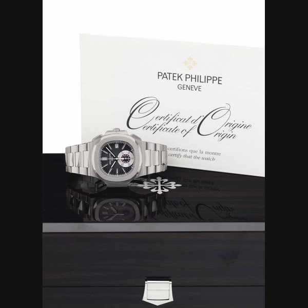 Patek Philippe. A Fine Stainless Steel Automatic Chronograph Wristwatch with Date, Bracelet, and Original Certificate and Box SIGNED PATEK PHILIPPE, GENÈVE, NAUTILUS MODEL, REF. 5980/1A, MOVEMENT NO. 4'040'278, CASE NO. 4'482'232, CIRCA 2009