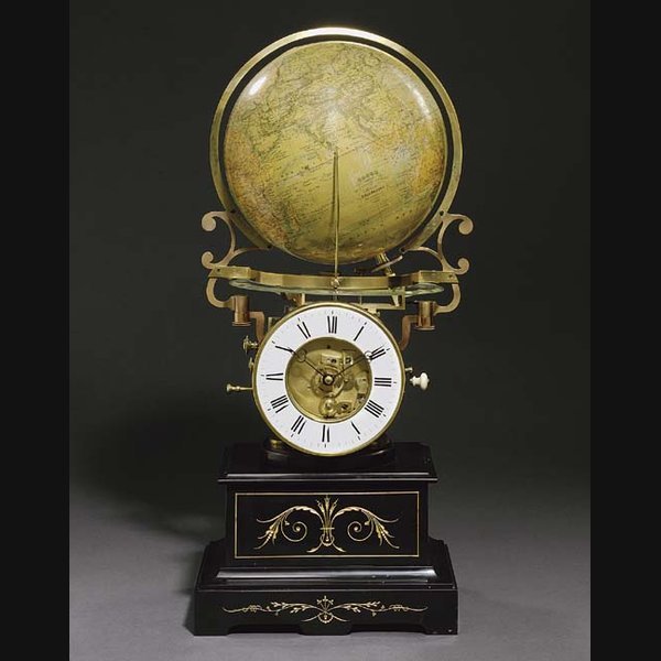 A French gilt-brass and black marble eight day revolving globe timepiece CHARLES HENARD & CIE., PARIS, THE GLOBE BY MAISON DELAMARCHE, PARIS. CIRCA 1880