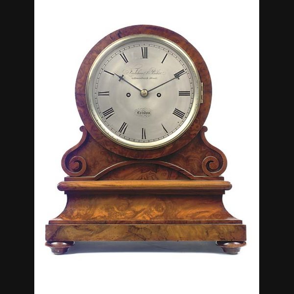 A Victorian walnut striking table clock, mid 19th Century