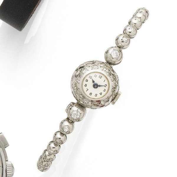 French. A lady's continental white gold and diamond set manual wind bracelet watch Case No.157762, Circa 1940