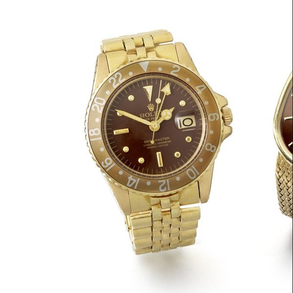 Rolex Rolex. An 18ct gold automatic calendar bracelet watch with 'root beer' bezel GMT-Master, Ref:1675, Serial No.365****, Movement No.D56****, Circa 1972 · 1675