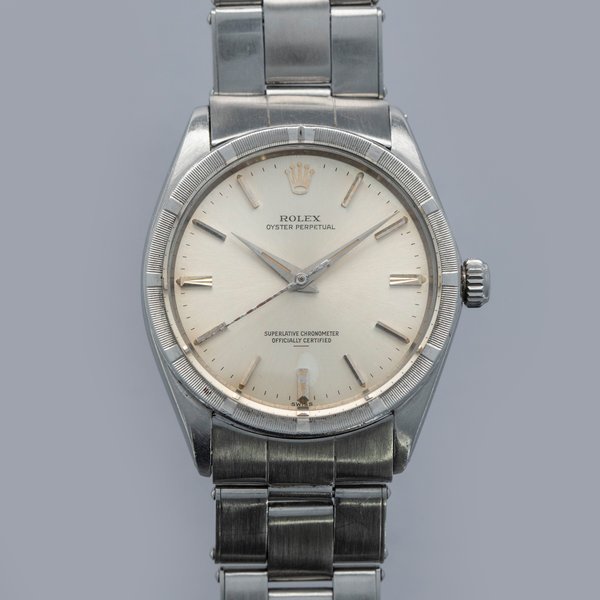 Rolex Rolex Oyster Perpetual 1007 Engine Turned Bezel Silver Underline Dial · 1007