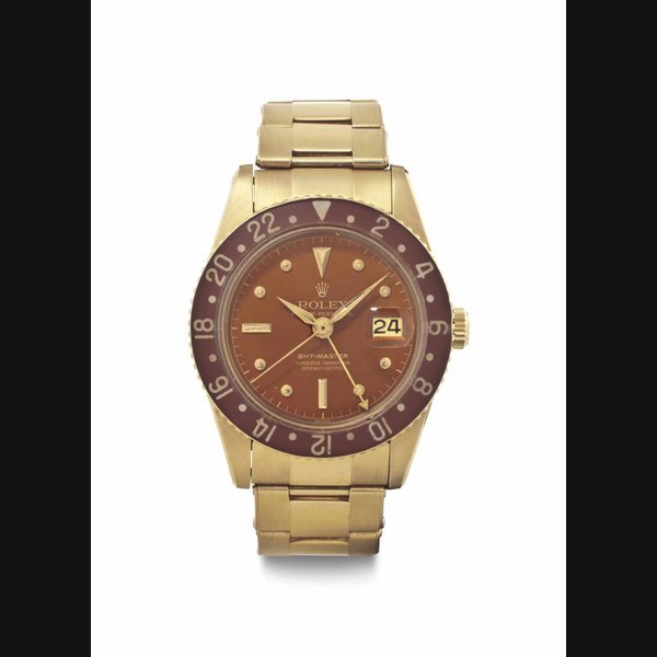 Rolex Rolex. A Very Rare and Attractive 18k Gold Automatic Dual Time Wristwatch with Bakelite Bezel, Date and Bracelet SIGNED ROLEX, OYSTER PERPETUAL, GMT-MASTER, REF. 6542, CASE NO. 424'243, CIRCA 1958