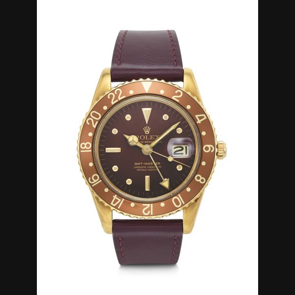 Rolex ROLEX, EXTREMELY RARE AND EARLY 18K GOLD DUAL TIME ‘GMT-MASTER’ WITH DATE AND 'NO CROWN GUARD' CASE, REF. 1675 · 1675