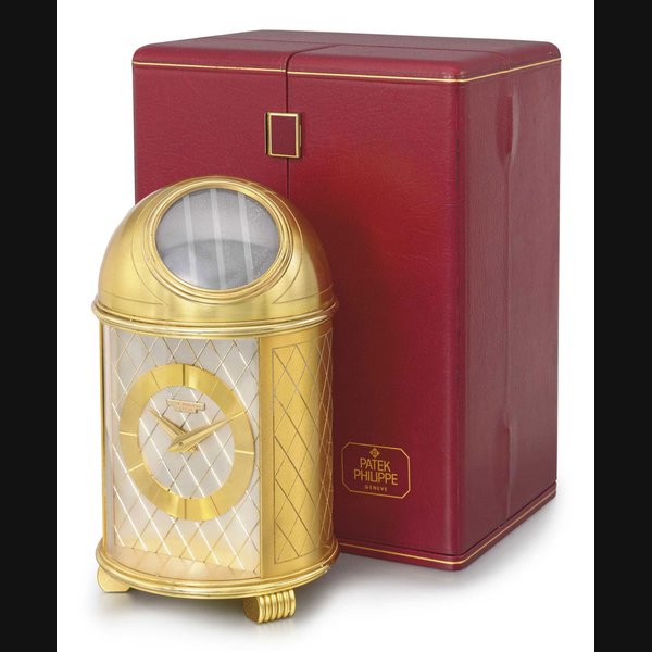 PATEK PHILIPPE. A FINE GILT BRASS SOLAR-POWERED DOMED TABLE CLOCK WITH ORIGINAL FITTED PRESENTATION BOX SIGNED PATEK PHILIPPE, GENEVE, MOVEMENT 872554, REF. 701, MANUFACTURED IN 1956