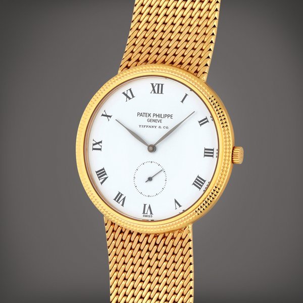 Patek Philippe Retailed by Tiffany & Co.: Reference 3919/5J | A yellow gold bracelet watch | Circa 1996 · 3919/5J