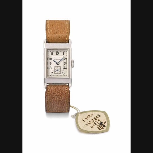 Longines. A fine stainless steel rectangular curved wristwatch with two-tone silvered dial and original sales tag Signed Longines, ref. 3713, movement no. 5'650'848, case no. 2211-4, circa 1940