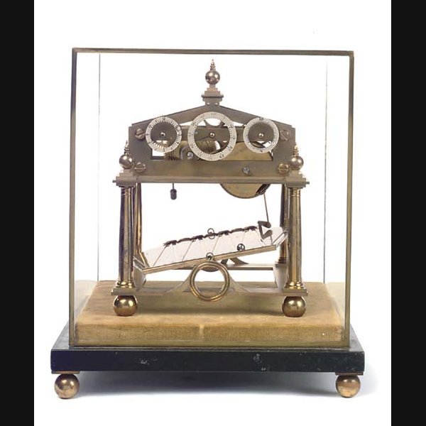 An English small brass and black slate Congreve-type rolling ball timepiece, 20th Century