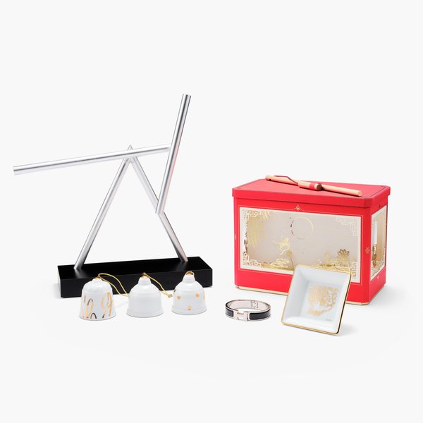 Chopard | Cartier | Hermès | MB&F | Romain Gauthier A set of one Romain Gauthier carrier bag, one Cartier lantern and one porcelain dish, three Chopard Christmas ornaments, one Hermès The H bracelet, one MB&F The Swinging Sticks, Circa 2015 to 2023