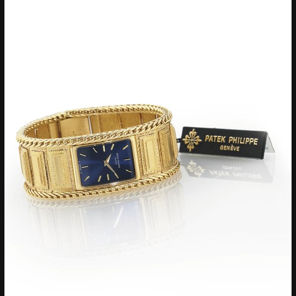 PATEK PHILIPPE. AN EXTREMELY FINE, RARE AND HEAVY 18K GOLD RECTANGULAR BRACELET WATCH SIGNED PATEK PHILIPPE, GENEVE, MOVEMENT NO. 1409957, CASE NO. 2742935, REF. 4241/4, MANUFACTURED IN 1984