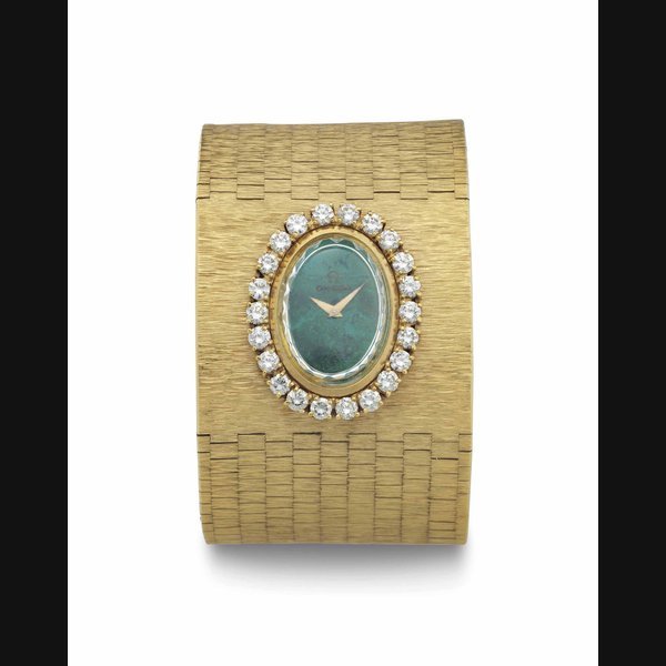 Omega Omega. A Lady's Fine and Unusual 18k Gold and Diamond-Set Cuff Bracelet with Malachite Dial SIGNED OMEGA, MOVEMENT NO. 28641926, CASE NO. 938, CIRCA 1970