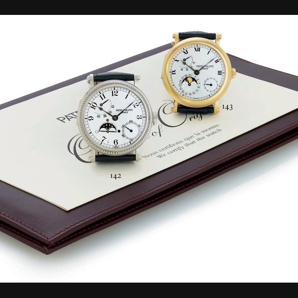 PATEK PHILIPPE. AN 18K GOLD AUTOMATIC WRISTWATCH WITH POWER RESERVE AND MOONPHASES SIGNED PATEK PHILIPPE, GENEVE, MOVEMENT NO. 3111474, CASE NO. 7082552, REF. 5054, MANUFACTURED IN 1999