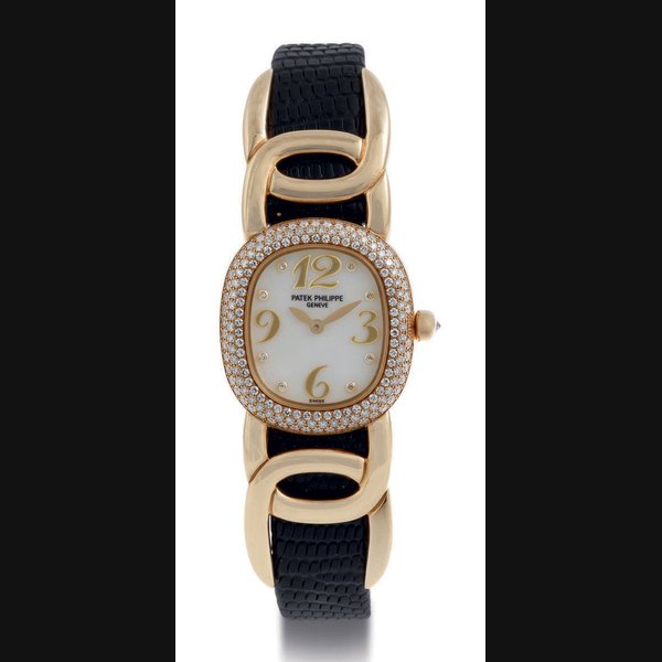 PATEK PHILIPPE. A LADY'S 18K GOLD, DIAMOND AND MOTHER-OF-PEARL WRISTWATCH SIGNED PATEK PHILIPPE, GENEVA, GOLDEN ELLIPSE MODEL, MOVEMENT NO. 1969955, CASE NO. 4057515, REF. NO. 4831, MANUFACTURED IN 1999